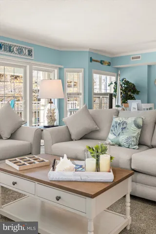 a view of a chair and tables in the balcony