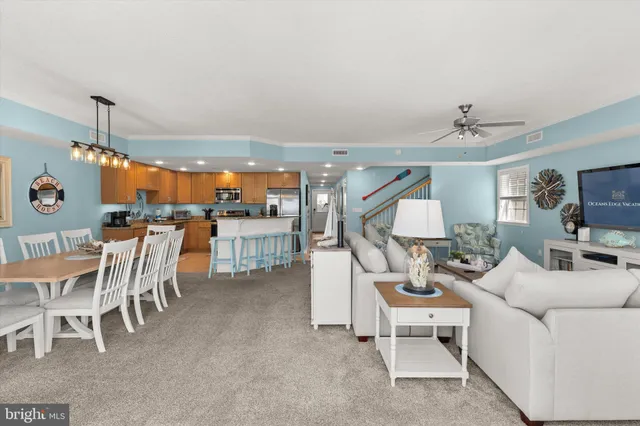 a view of a room that has a table and chairs