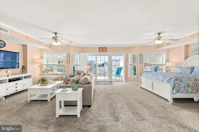a view of a dining room with furniture and a window