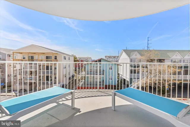a view of a bathroom with a shower and a sink
