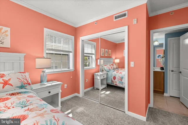 a spacious bathroom with a granite countertop sink a mirror and a shower