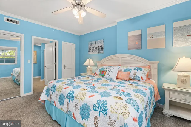 a bathroom with a sink vanity mirror and toilet