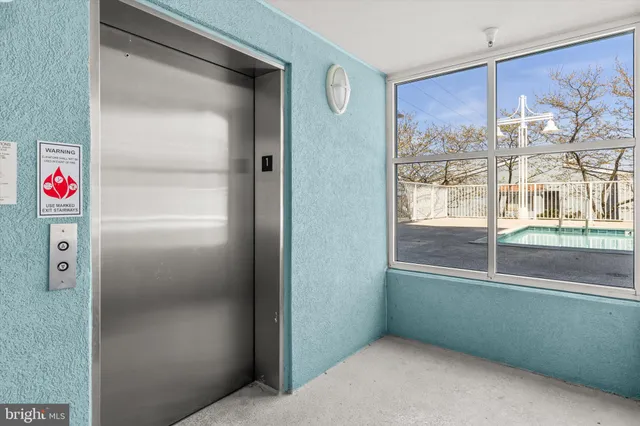 a kitchen with granite countertop a sink a stove and cabinets
