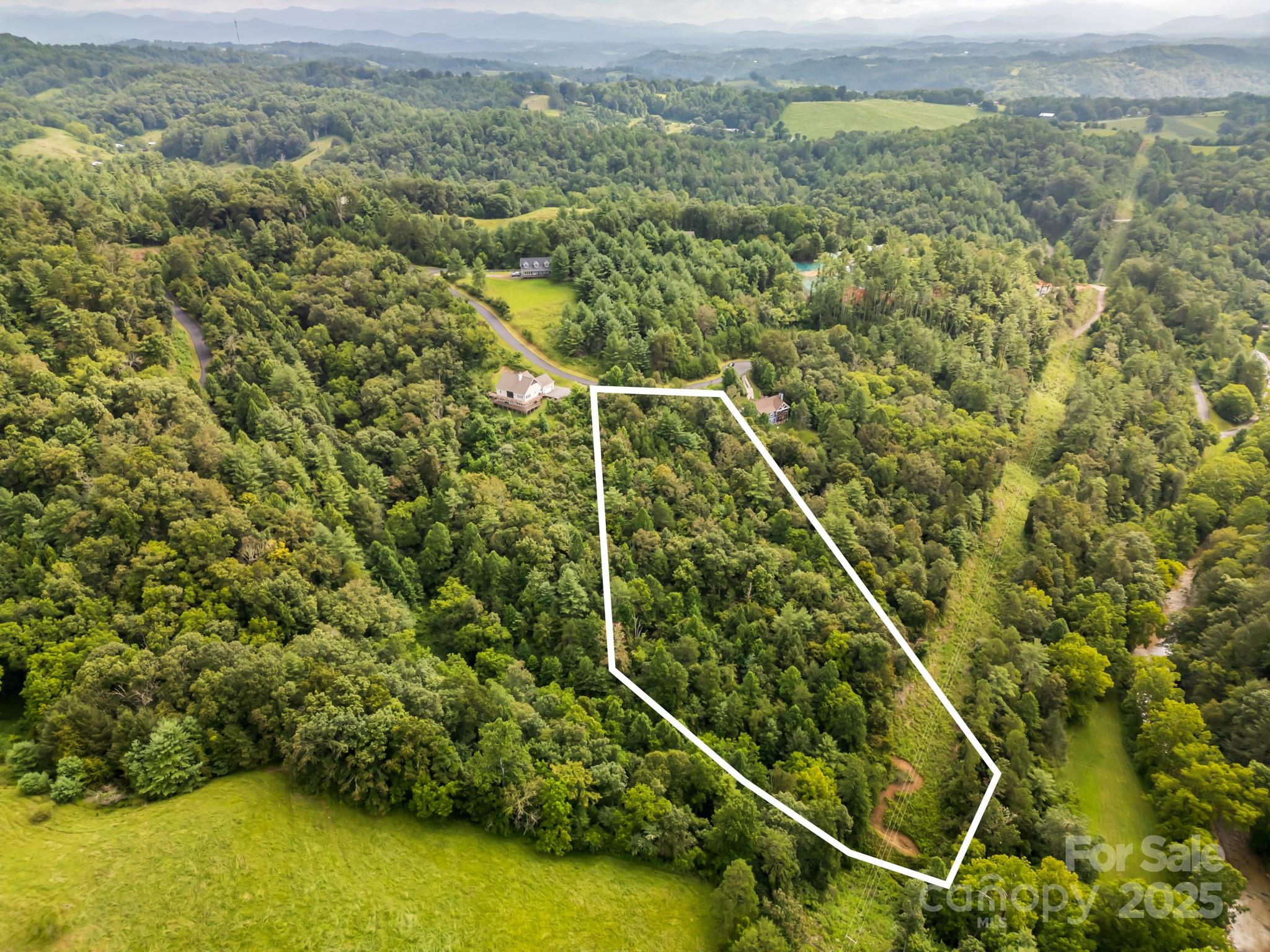 a view of a yard from a balcony