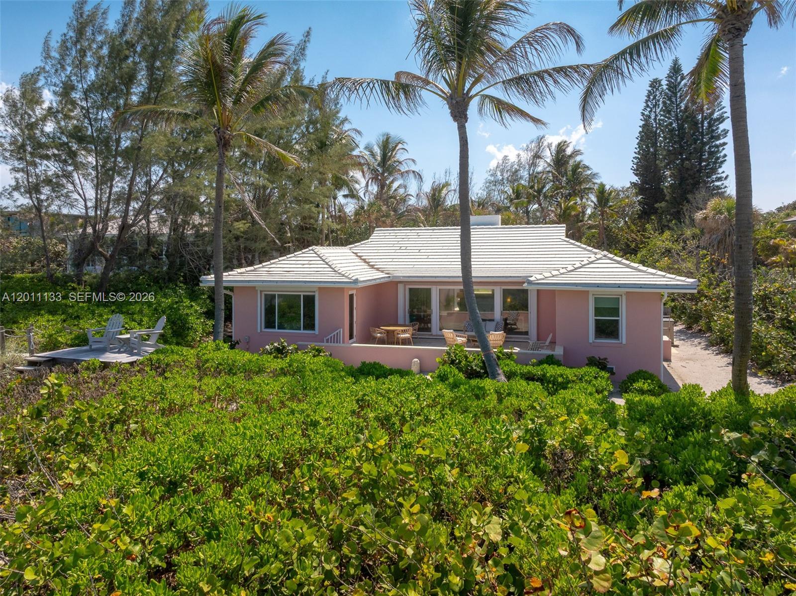 55 North Beach Road Jupiter Island, FL 33455 - Photo 27 of 56 a front view of a house with a garden