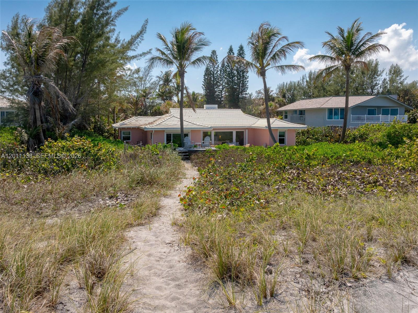 55 North Beach Road Jupiter Island, FL 33455 - Photo 32 of 56 a view of a garden with palm trees