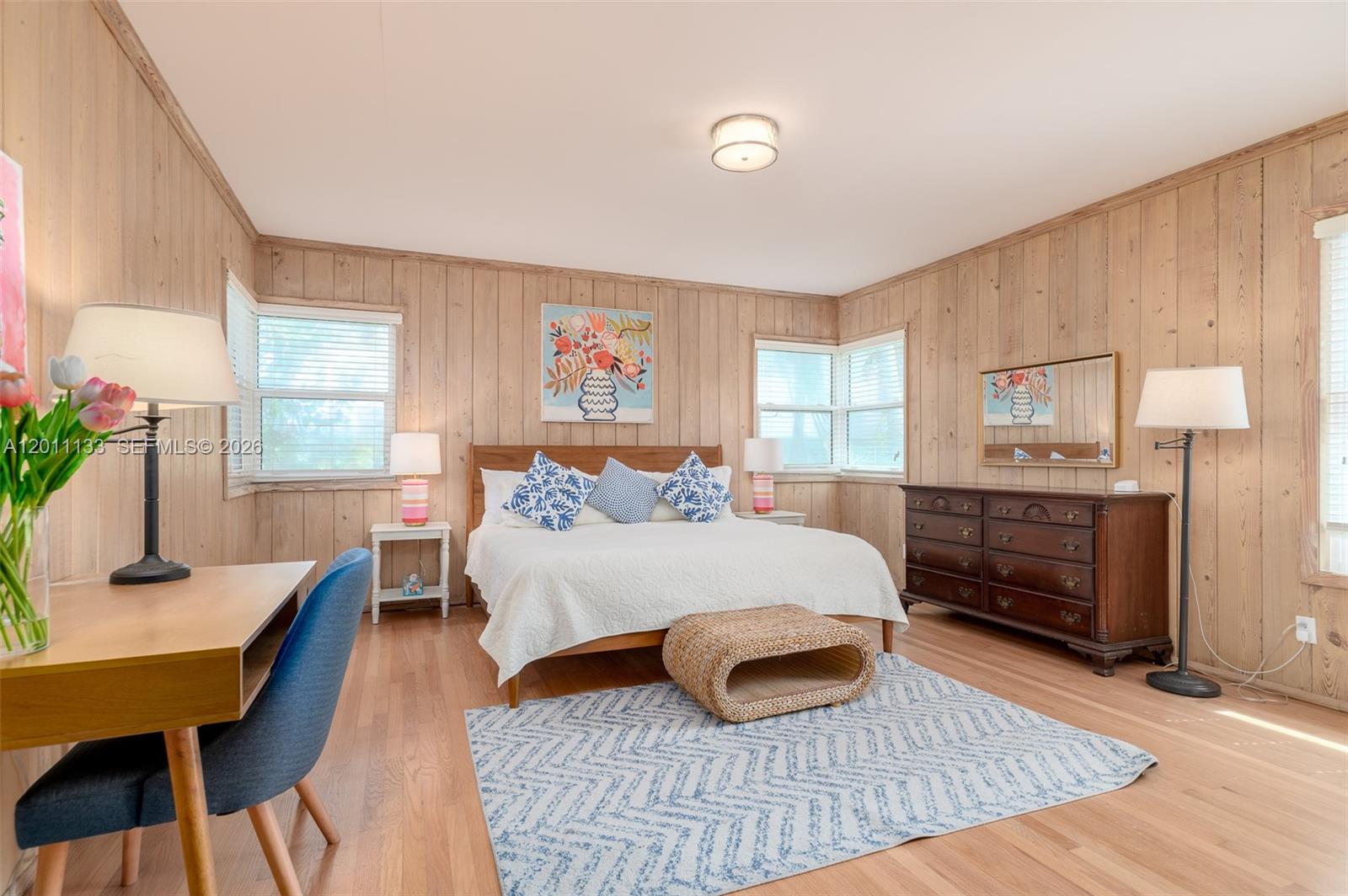 55 North Beach Road Jupiter Island, FL 33455 - Photo 40 of 56 a bedroom with a bed and wooden floor