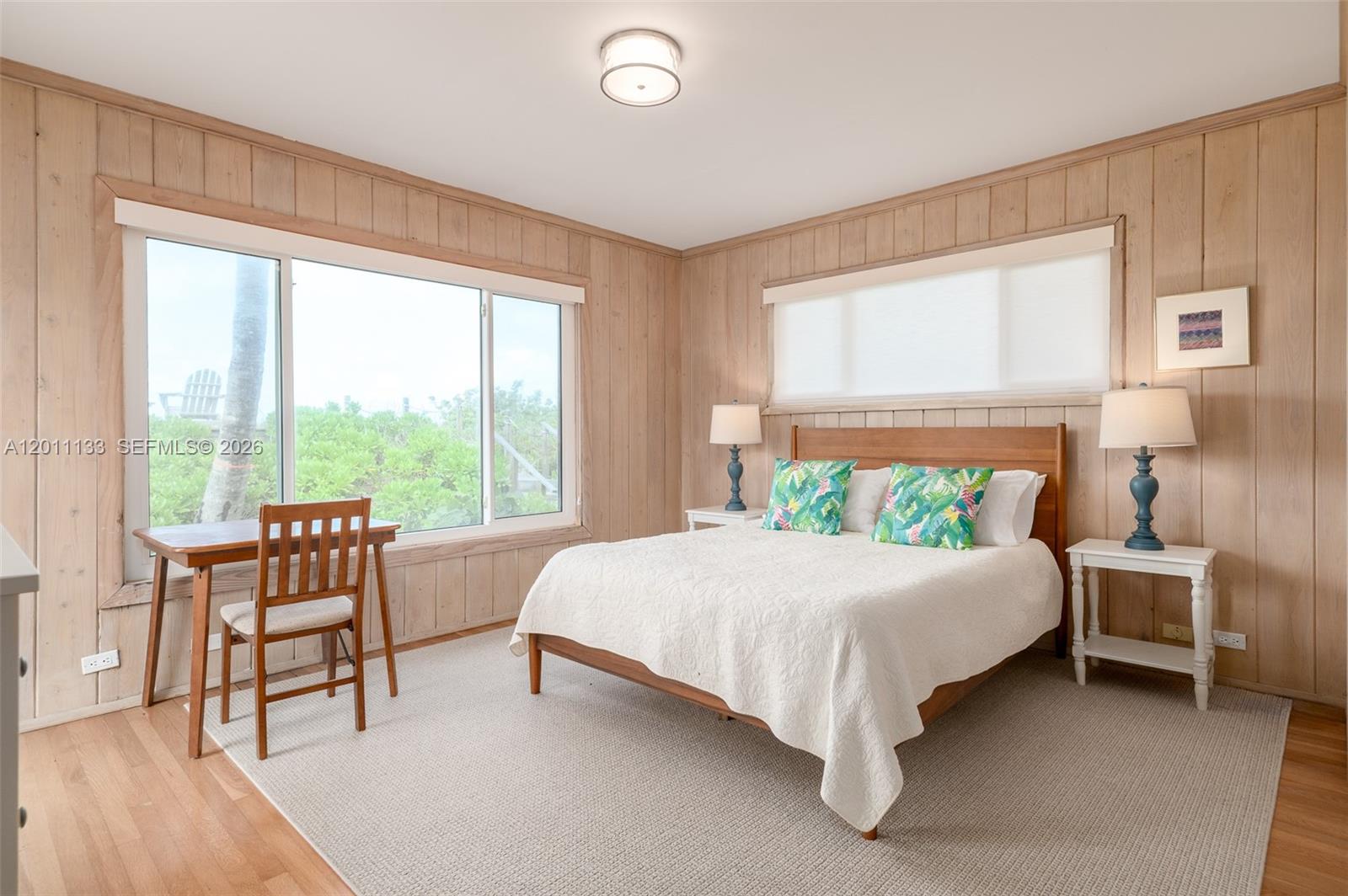 55 North Beach Road Jupiter Island, FL 33455 - Photo 43 of 56 a bed sitting in a bedroom next to a window