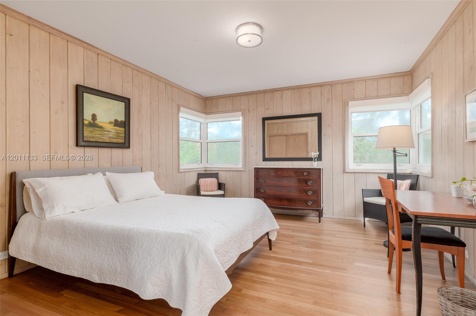 55 North Beach Road Jupiter Island, FL 33455 - Photo 45 of 56 a spacious bedroom with a bed a dresser and next to a window