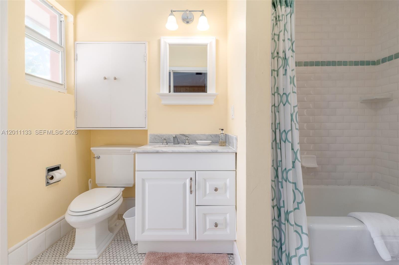 55 North Beach Road Jupiter Island, FL 33455 - Photo 46 of 56 a bathroom with a granite countertop toilet a sink and a mirror