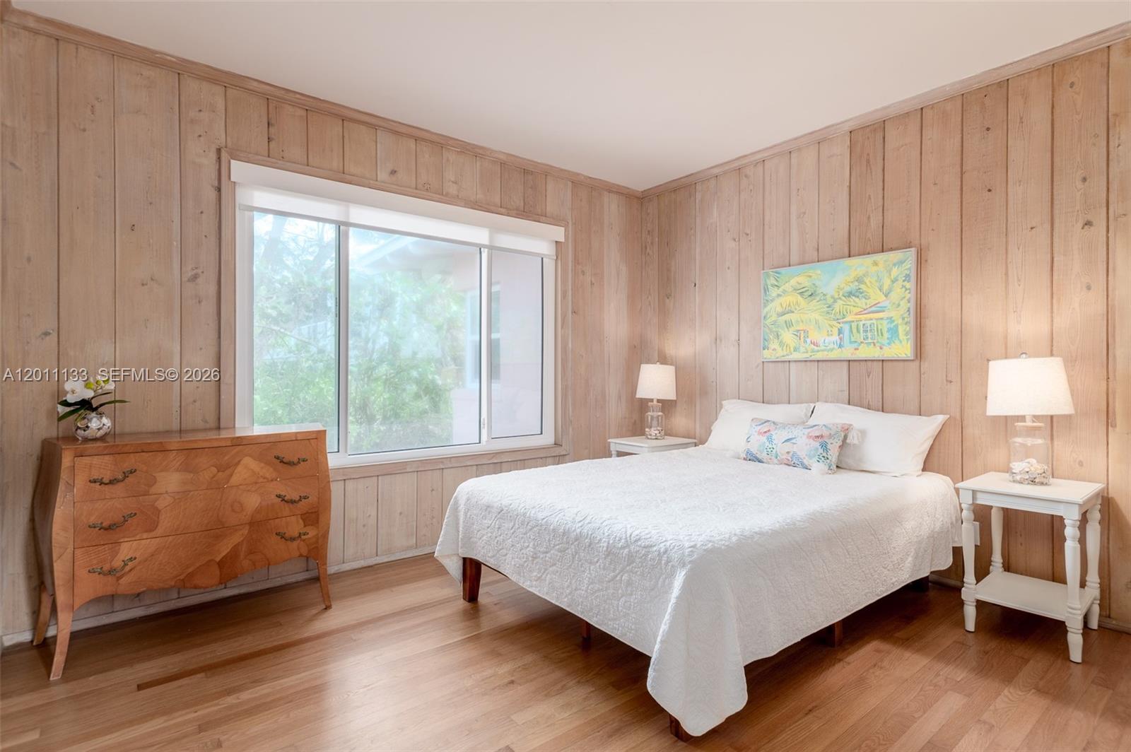 55 North Beach Road Jupiter Island, FL 33455 - Photo 47 of 56 a bedroom with a bed and a large window