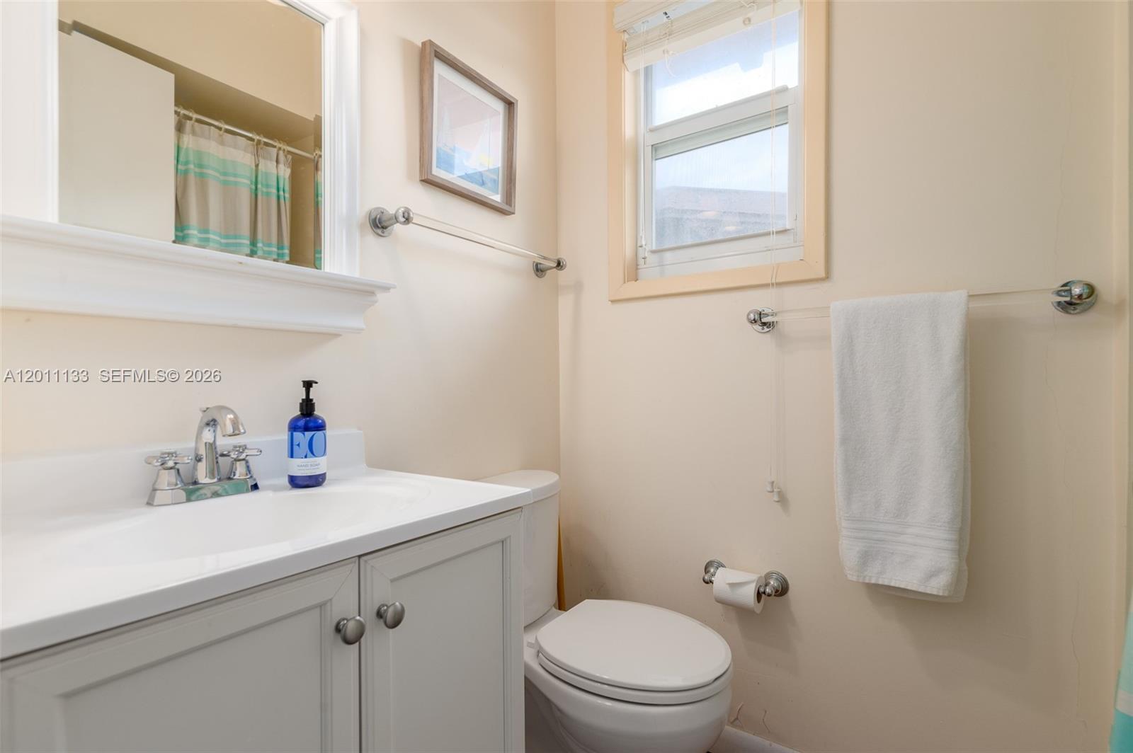 55 North Beach Road Jupiter Island, FL 33455 - Photo 49 of 56 a bathroom with a sink a toilet and a window