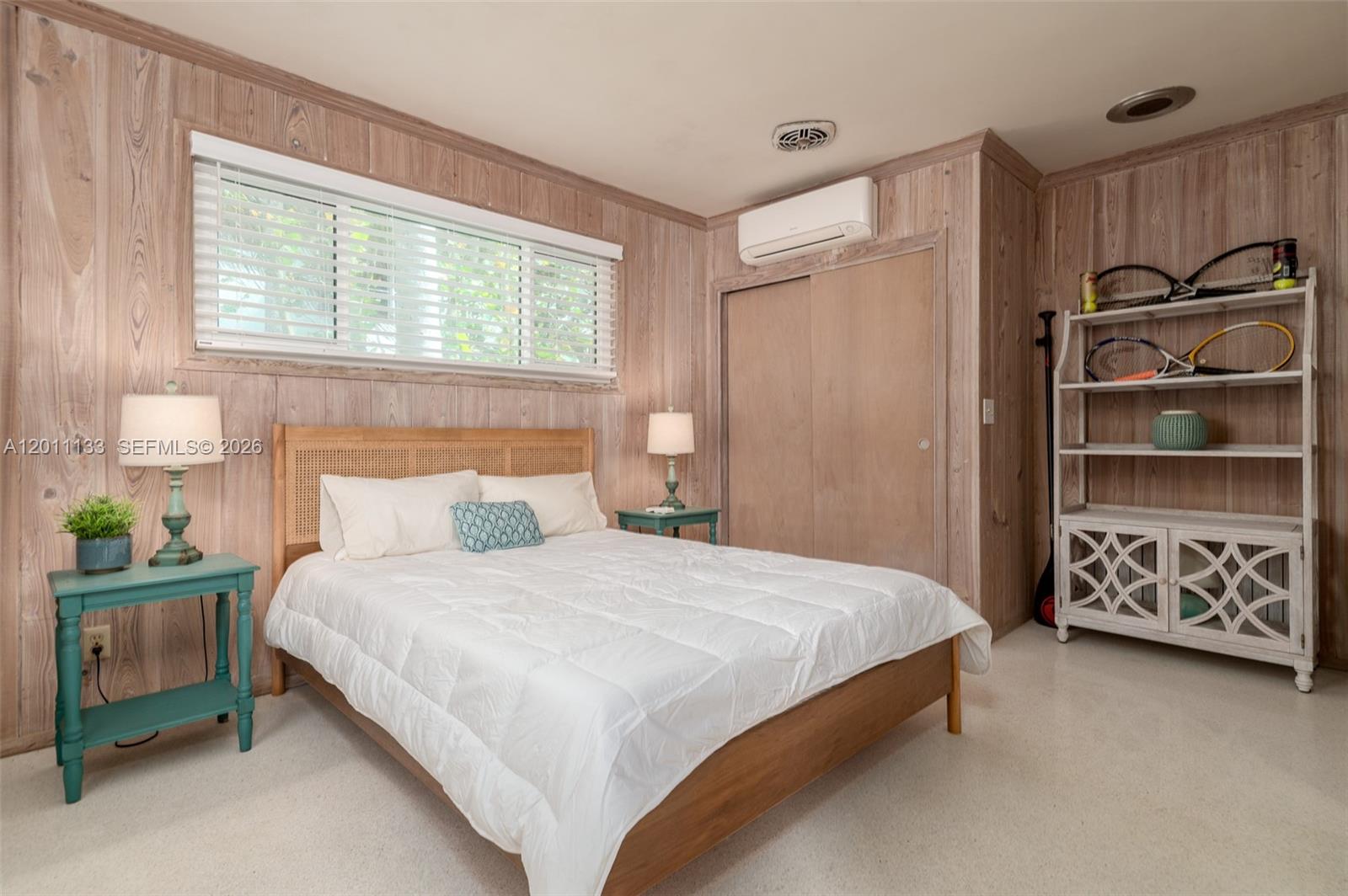 55 North Beach Road Jupiter Island, FL 33455 - Photo 54 of 56 a bedroom with a bed and a window