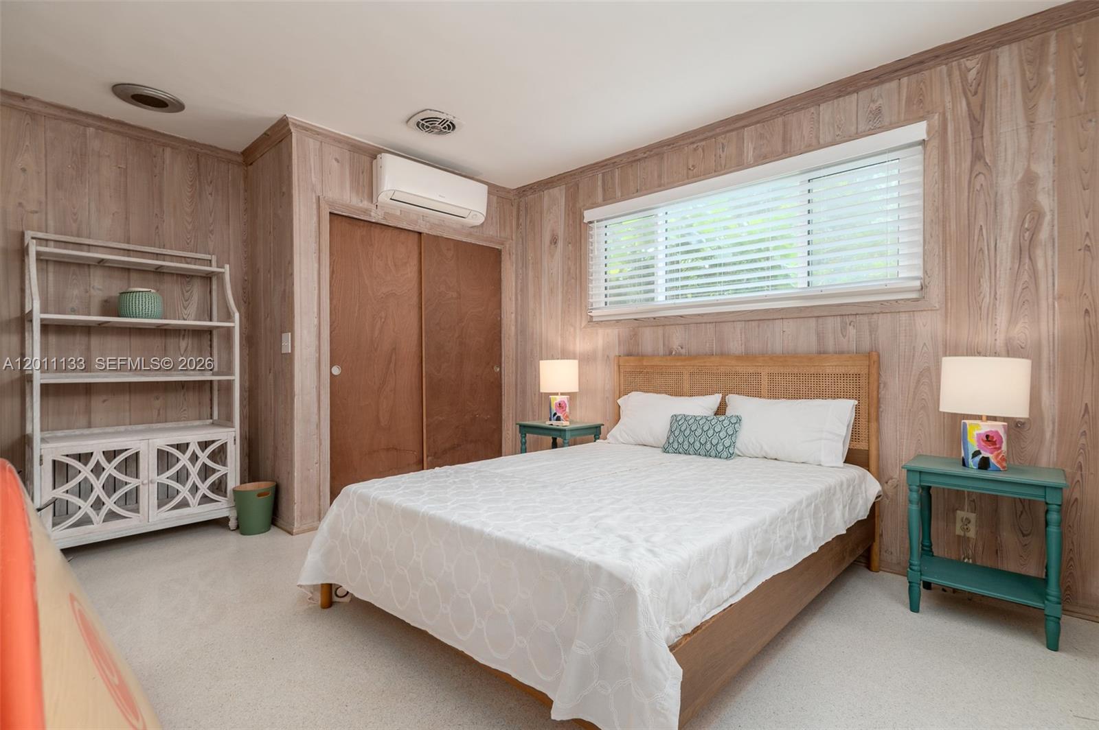 55 North Beach Road Jupiter Island, FL 33455 - Photo 55 of 56 a bedroom with a bed and a window