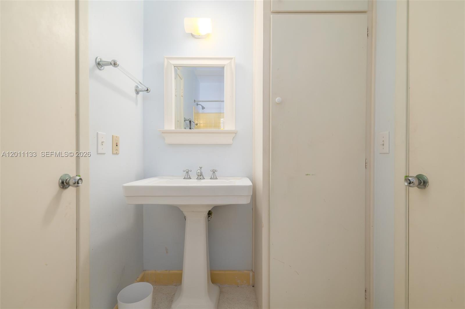 55 North Beach Road Jupiter Island, FL 33455 - Photo 56 of 56 a bathroom with a sink a toilet and shower
