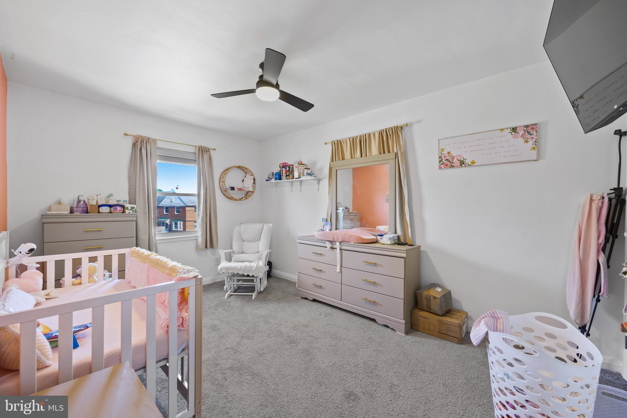4511 Marble Hall Road Baltimore, MD 21239 - Photo 27 of 48 a bedroom with furniture and a wooden floor