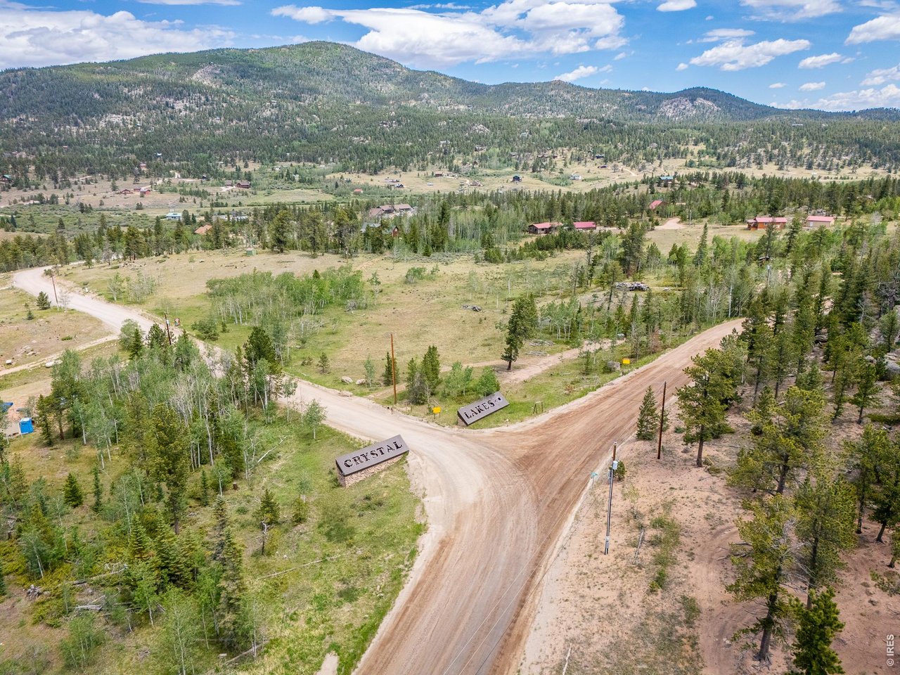 22 Tami Road Red Feather Lakes, CO 80545 - Photo 19 of 33 Crystal Lakes main entrance to the "compound" area.