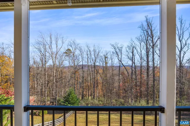 a view of a yard from a balcony