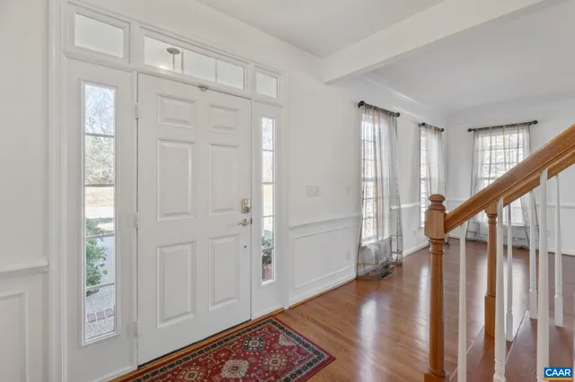 a view of entryway with wooden floor