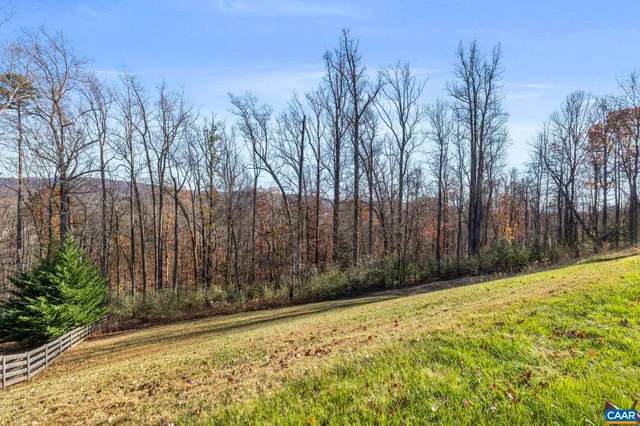 a view of a backyard of the house
