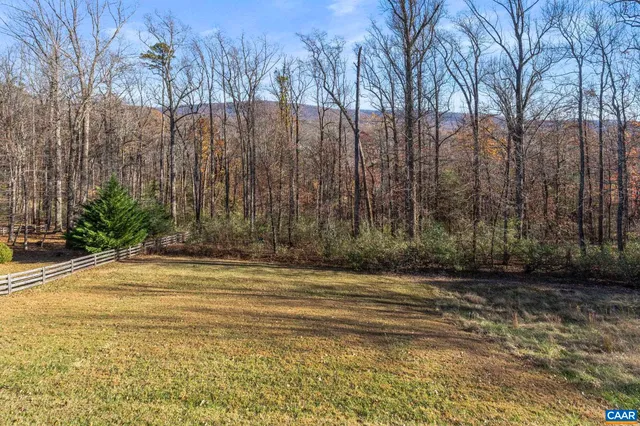 a view of a brick house with many windows