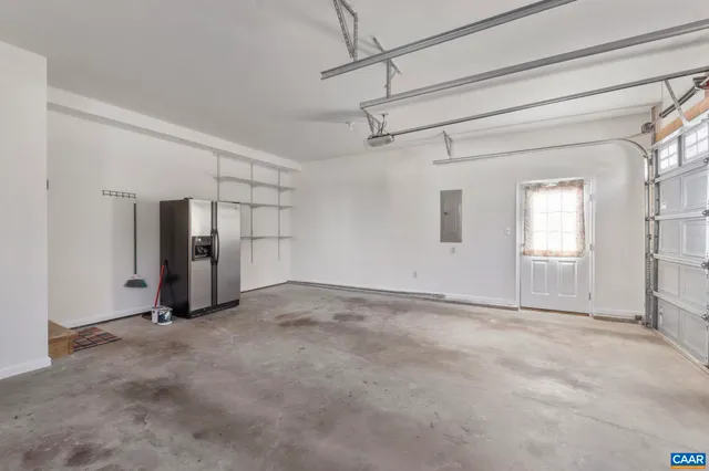 a view of an empty room with windows