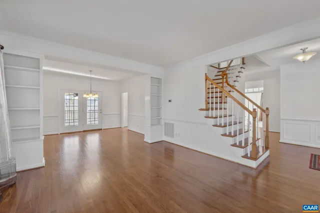 a view of an entryway with wooden floor