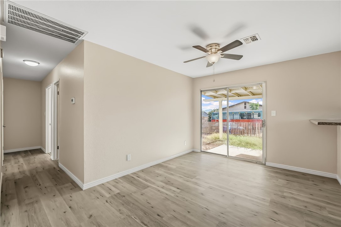1720 Valencia Road Fort Mohave, AZ 86426 - Photo 19 of 32 Spacious room with wood-finish flooring and a ceiling fan with integrated lighting
