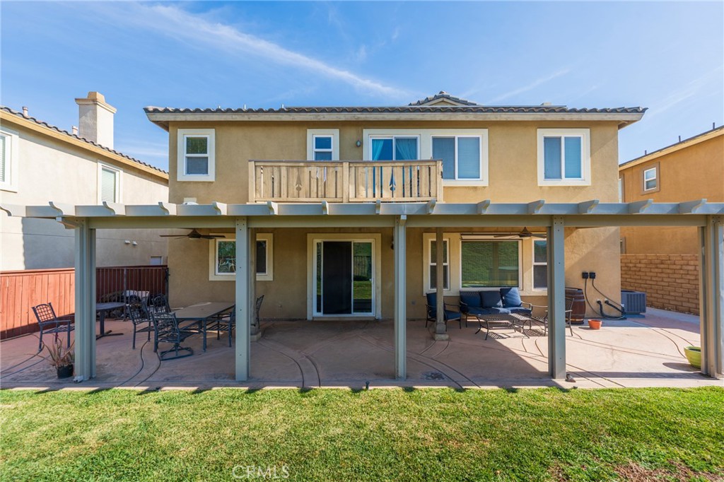 17073 Spring Canyon Place Riverside, CA 92503 - Photo 27 of 43 a view of a house with a yard porch and furniture