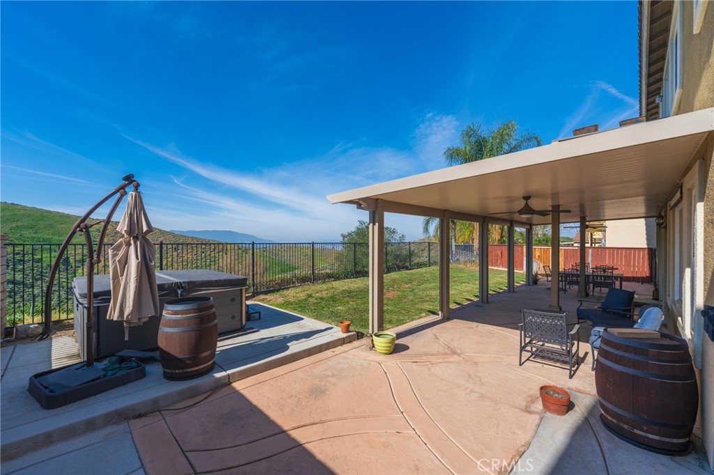 17073 Spring Canyon Place Riverside, CA 92503 - Photo 29 of 43 a view of a patio with chairs and a table and chairs