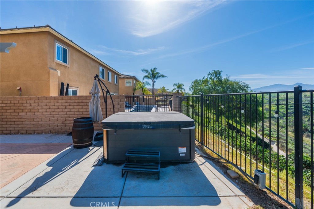 17073 Spring Canyon Place Riverside, CA 92503 - Photo 30 of 43 a balcony with table and chairs
