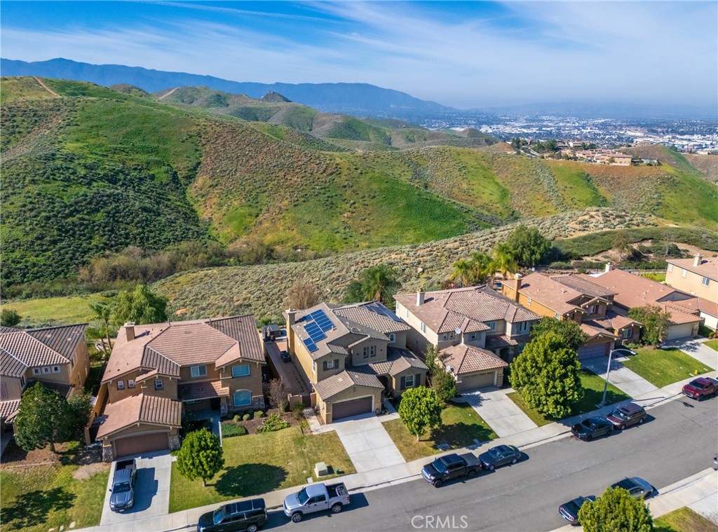 17073 Spring Canyon Place Riverside, CA 92503 - Photo 41 of 43 an aerial view of a city with lots of residential buildings ocean and mountain view in back