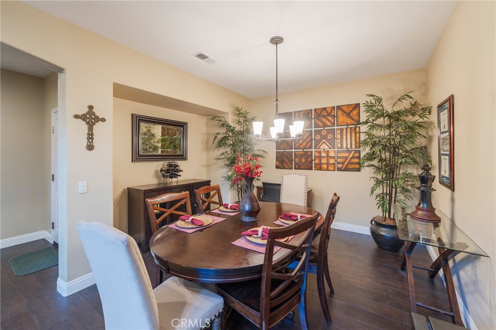 17073 Spring Canyon Place Riverside, CA 92503 - Photo 6 of 43 a view of a dining room with furniture window and wooden floor