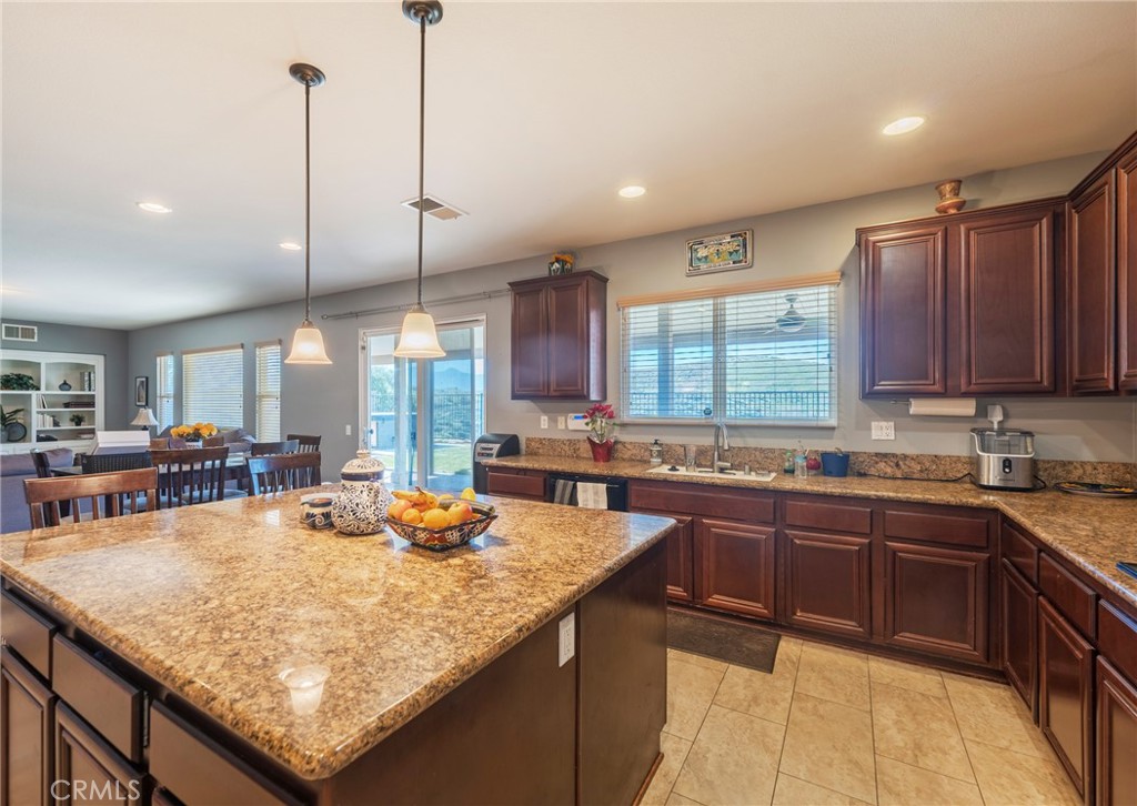 17073 Spring Canyon Place Riverside, CA 92503 - Photo 9 of 43 a kitchen with sink and view of living room