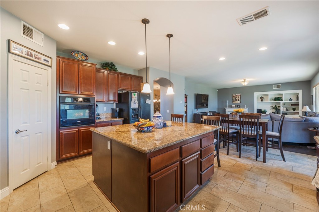 17073 Spring Canyon Place Riverside, CA 92503 - Photo 10 of 43 a large kitchen island in the center