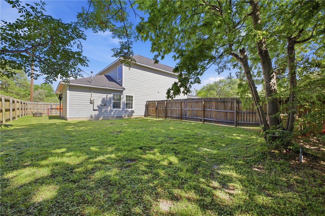4400 Milam Street Bryan, TX 77801 - Photo 21 of 25 a view of a house with a yard