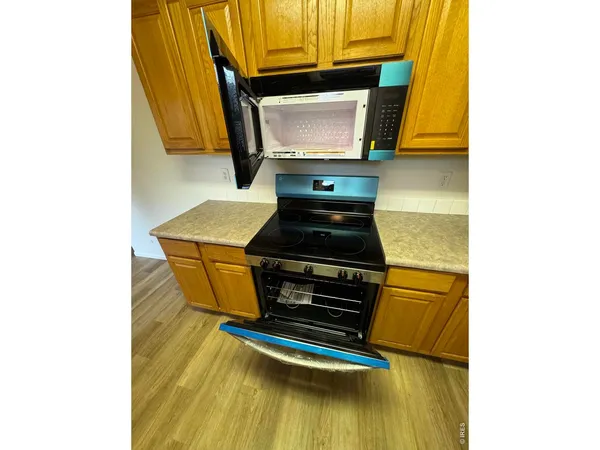 a view of a kitchen from the hallway