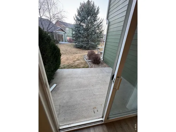 a view of a hallway with stairs