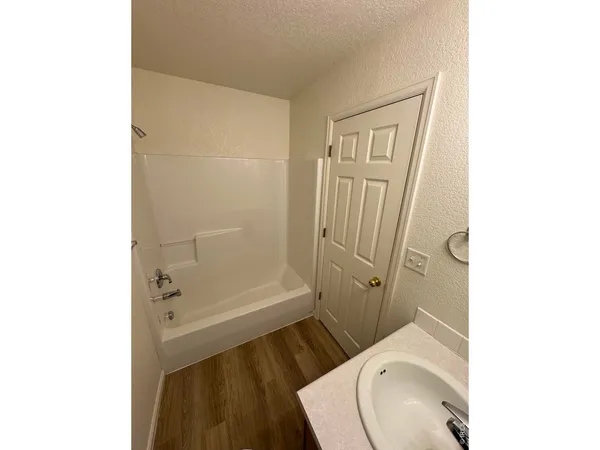 a view of bedroom and hallway