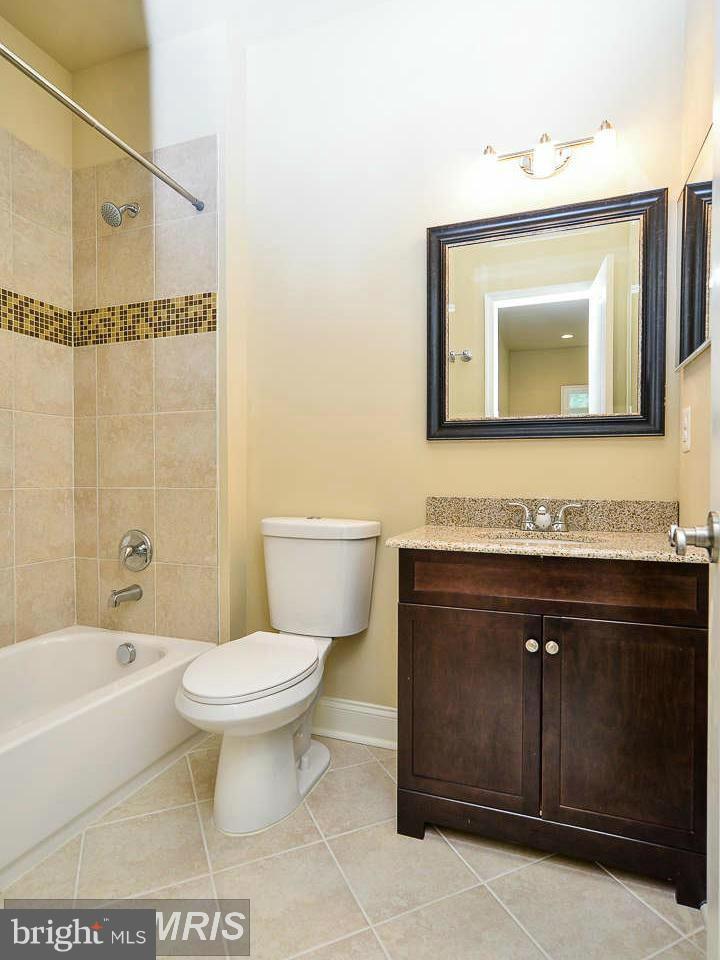 8536 Old Keene Mill Road Springfield, VA 22152 - Photo 23 of 30 a bathroom with a sink vanity mirror and toilet