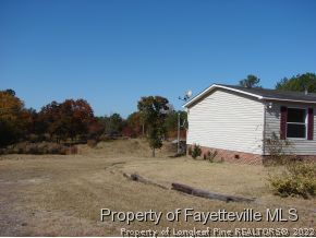 272 Line Road Cameron, NC 28326 - Photo 3 of 25 a view of outdoor space yard and basketball court