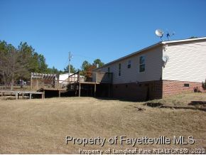 272 Line Road Cameron, NC 28326 - Photo 4 of 25 a view of a house with a outdoor space