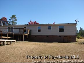 272 Line Road Cameron, NC 28326 - Photo 5 of 25 a front view of a house with a balcony