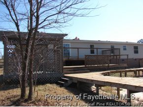 272 Line Road Cameron, NC 28326 - Photo 6 of 25 a view of house with a yard and furniture