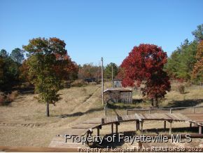 272 Line Road Cameron, NC 28326 - Photo 9 of 25 a view of house with outdoor space and sitting area