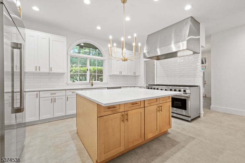 201 Dryden Road Bernardsville, NJ 07924 - Photo 11 of 48 a kitchen with a stove a sink and a refrigerator