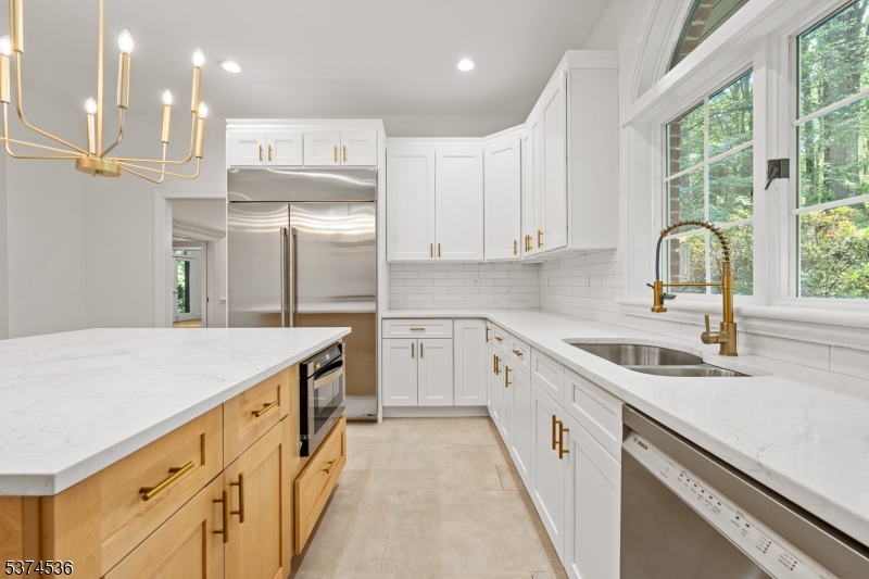 201 Dryden Road Bernardsville, NJ 07924 - Photo 12 of 48 a kitchen with a sink stove and cabinets