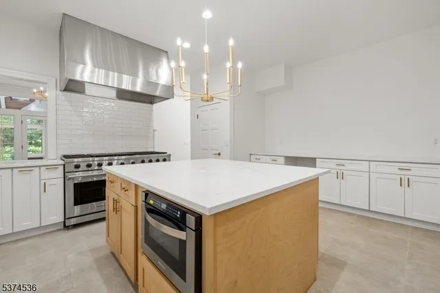 a kitchen that has a sink and a stove