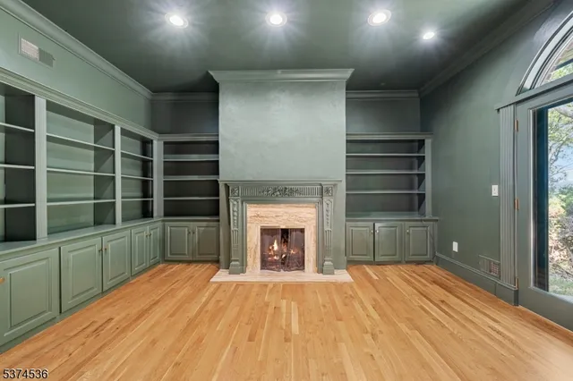 a room with a fireplace and a window