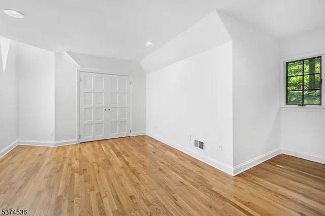 a bathroom with a sink mirror and vanity